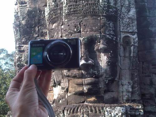 I am made of stone and I'm on everybody's picture when visiting Cambodia's Angkor temples... Who am I ?